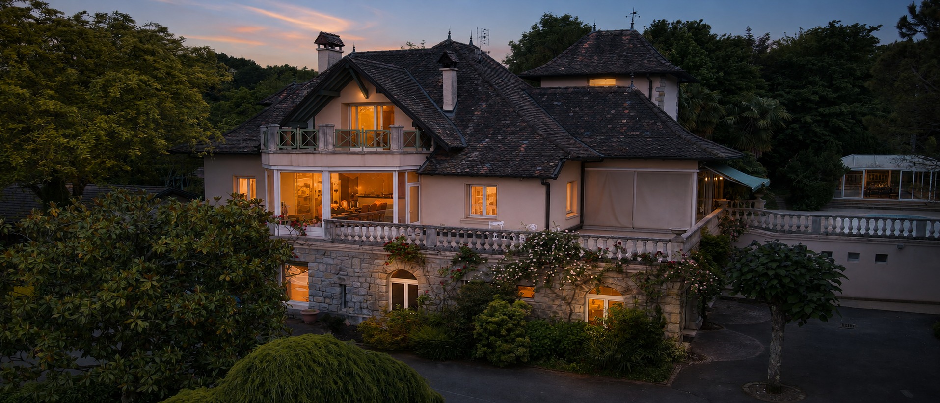 Clos des Savoyances at dusk with warm windows. Enhanced photograph.